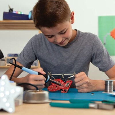 Child with soldering kit LED Heart